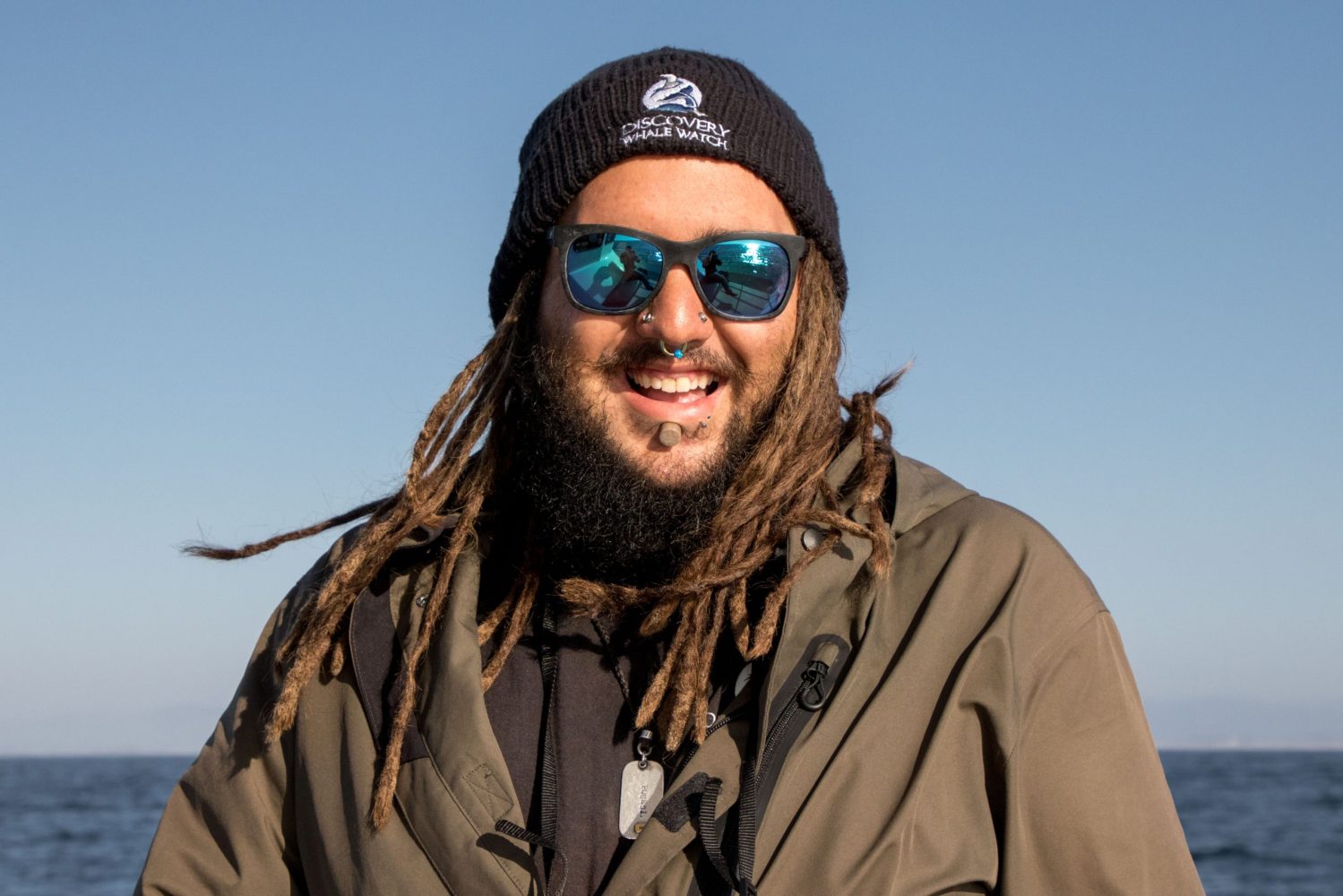 a man wearing sunglasses posing for the camera