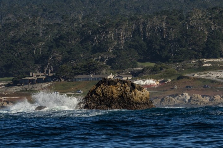 a body of water with a mountain in the background