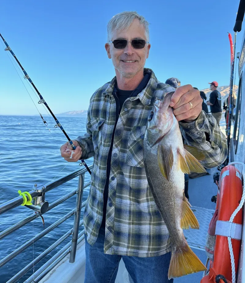 Matt Arcoleo – Owner a man holding a fish